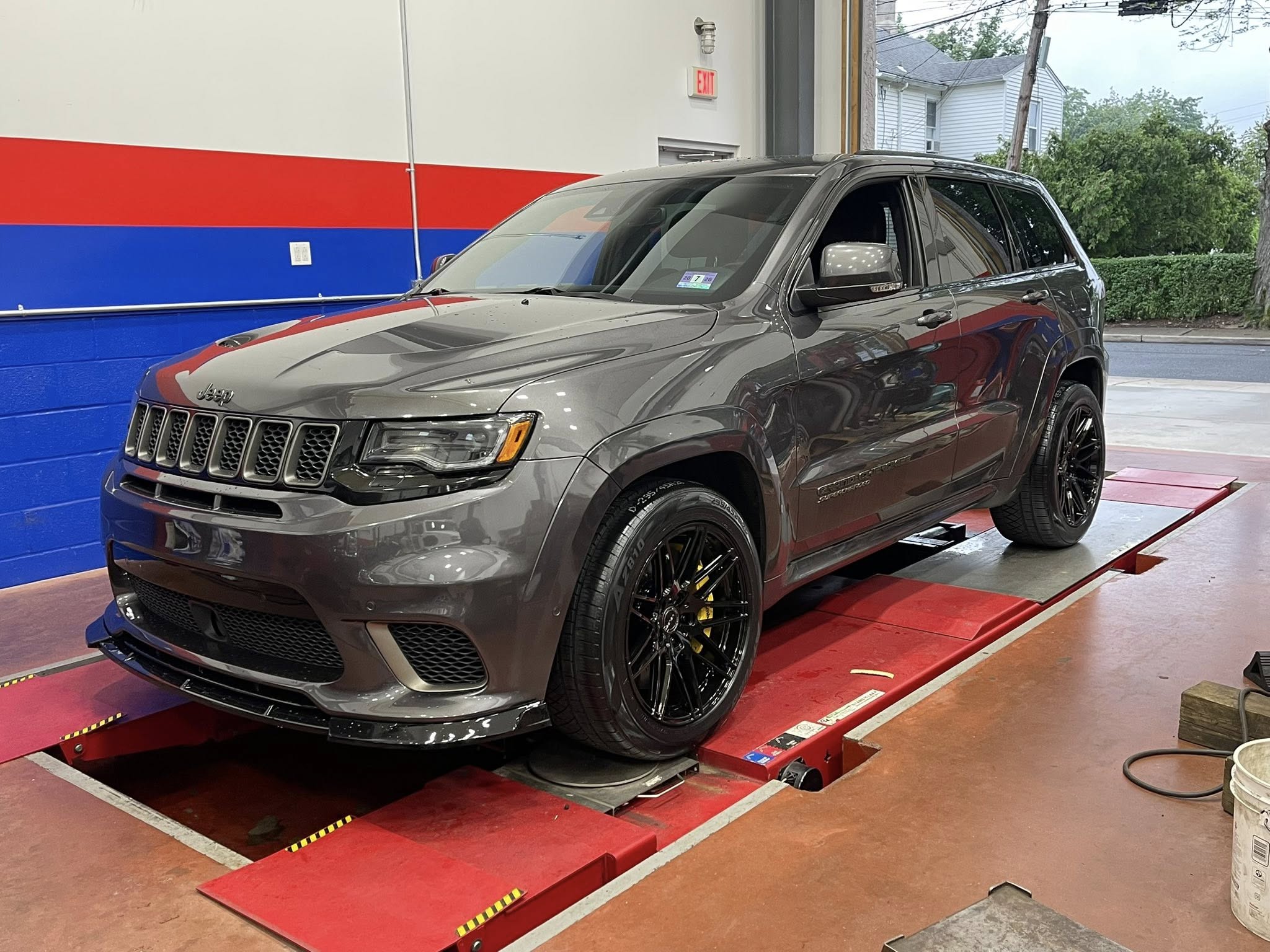 Jeep Trackhawk with its new wheels in the shop